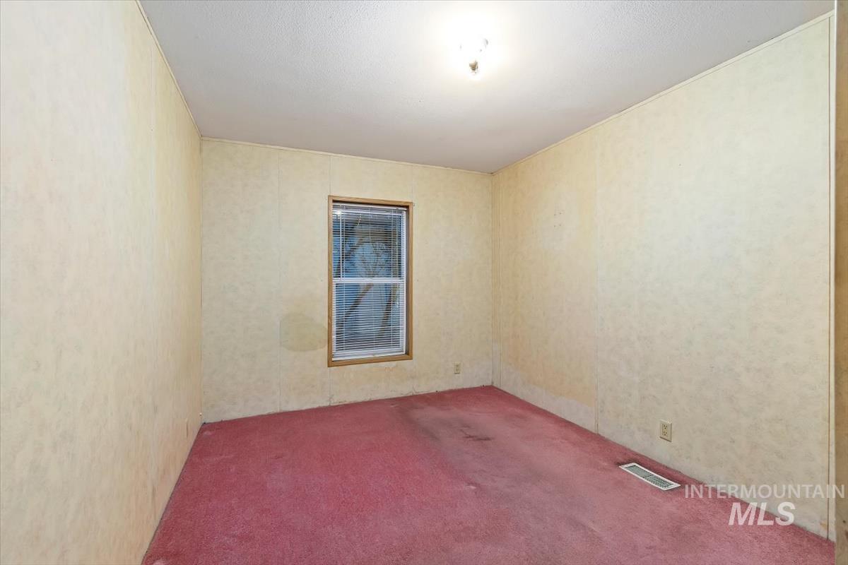 2804 Golden Rod Lane Caldwell, ID 83605 - Photo 4 of 35 View of carpeted empty room