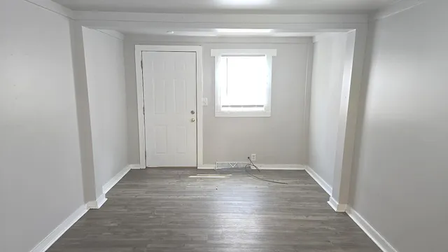 a kitchen with refrigerator and window