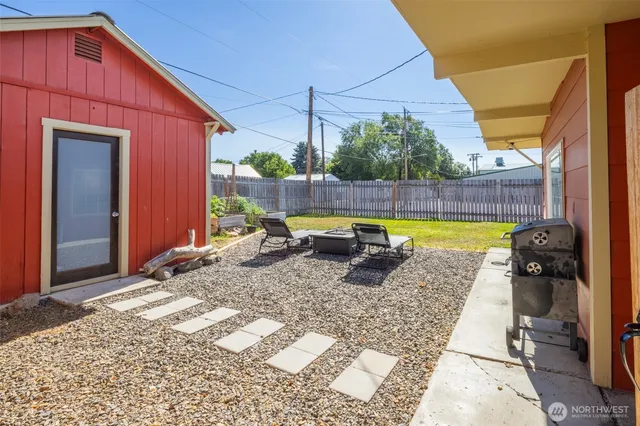 a view of a swimming pool with a lounge chairs in patio