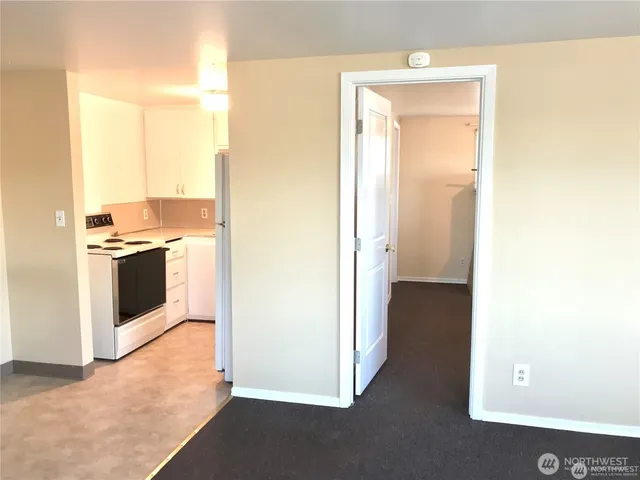 a view of a kitchen with a stove top oven