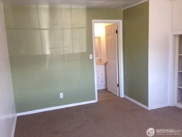an empty room and closet area