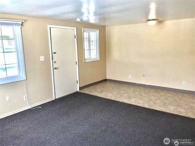 an empty room with windows