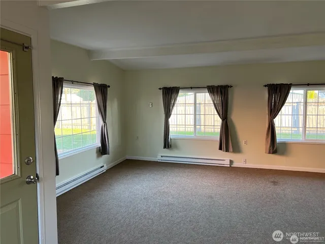 an empty room with a fireplace