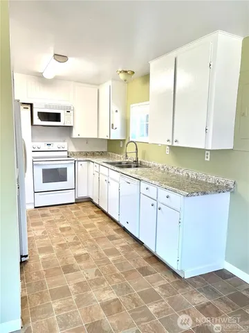 a view of a kitchen with a sink