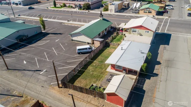 an aerial view of a house with outdoor space