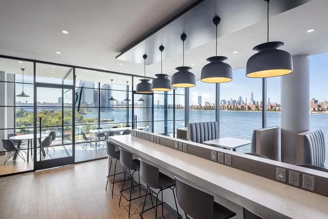 a bathroom with a glass shower door