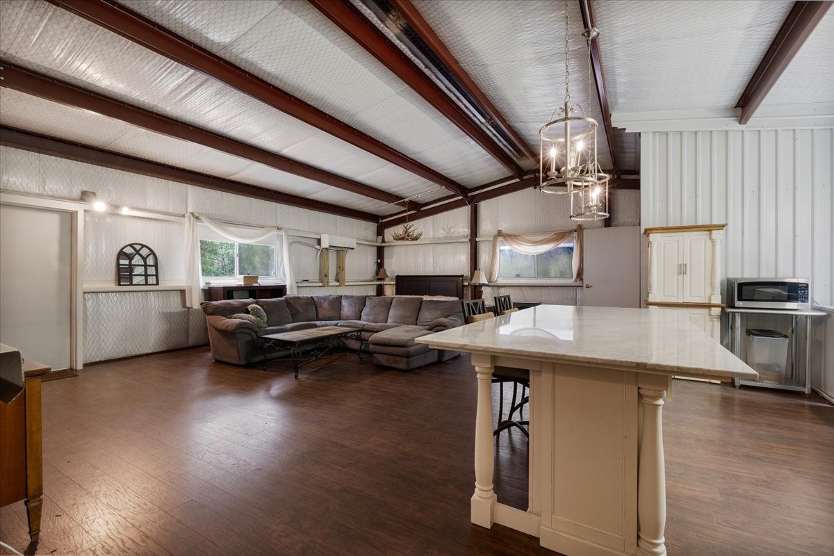 16375 Grand Flower Road Plantersville, TX 77363 - Photo 12 of 50 a living room with furniture and kitchen view