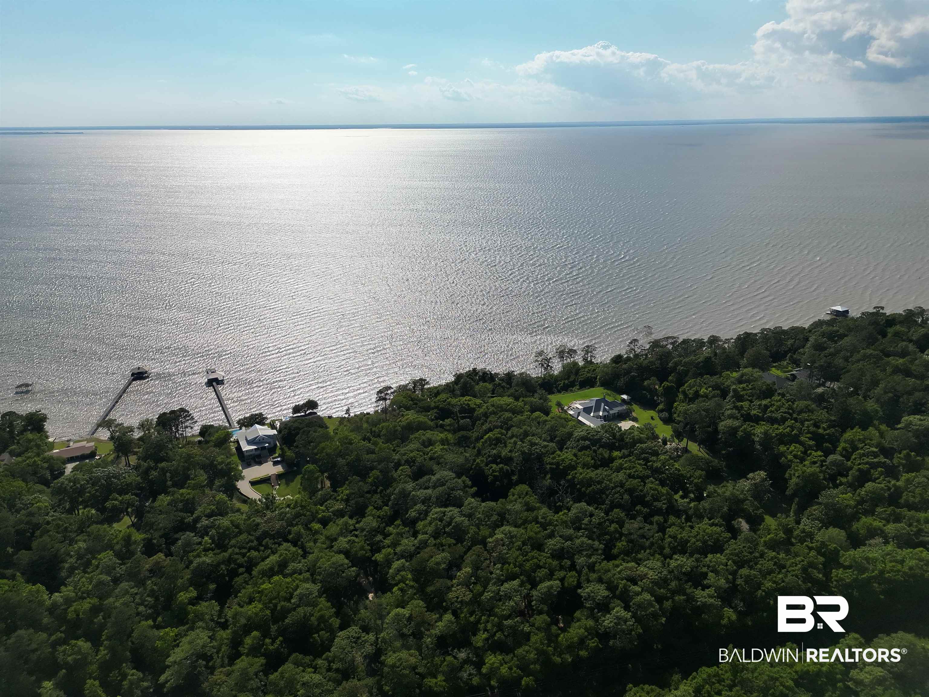 22951 Main Street Fairhope, AL 36532 - Photo 8 of 13 Aerial view of property and surrounding area featuring a nearby body of water and a forest