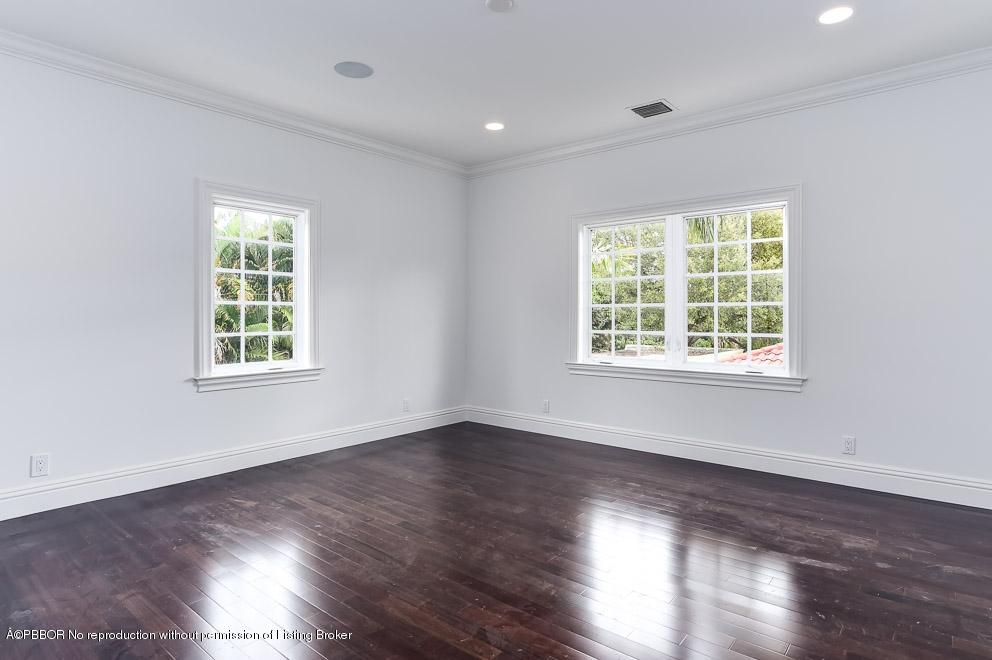 277 Cordova Road West Palm Beach, FL 33401 - Photo 11 of 18 a view of an empty room with wooden floor and a window