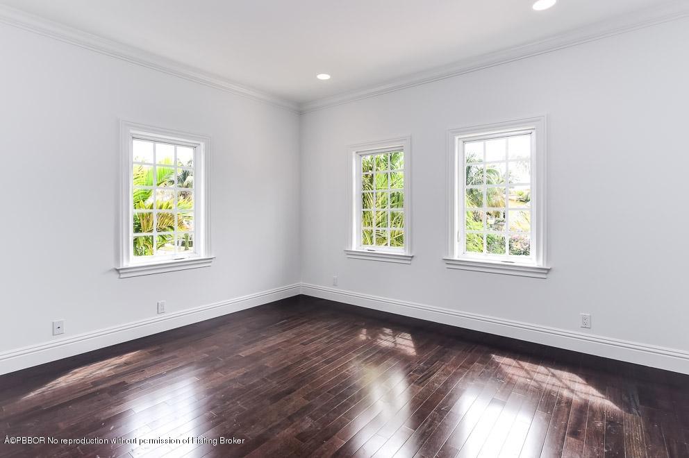 277 Cordova Road West Palm Beach, FL 33401 - Photo 14 of 18 a view of an empty room with wooden floor and a window