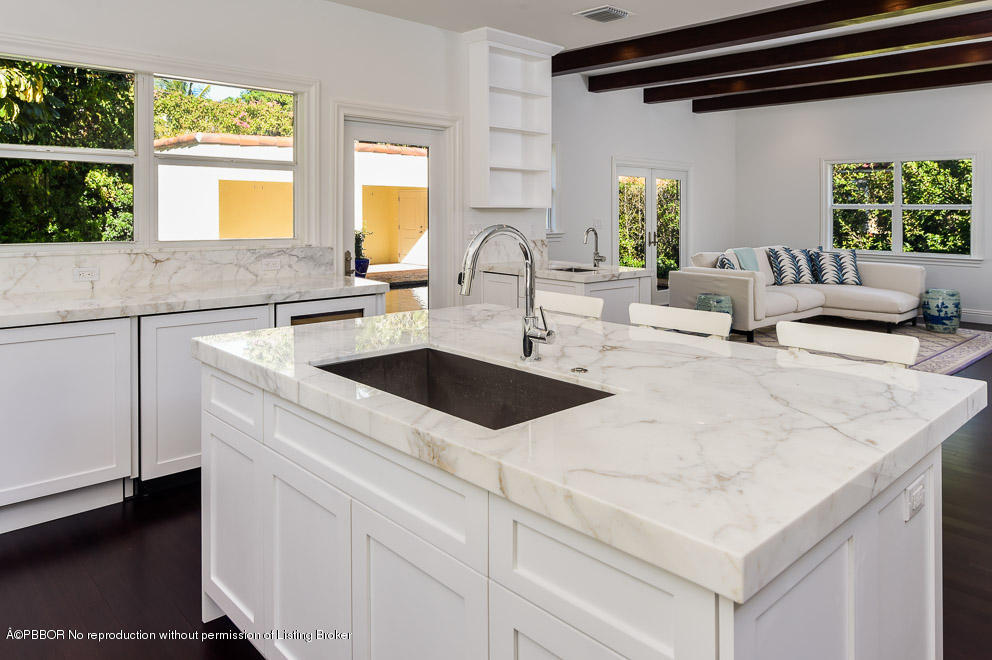 277 Cordova Road West Palm Beach, FL 33401 - Photo 7 of 18 a kitchen with a sink a stove and cabinets
