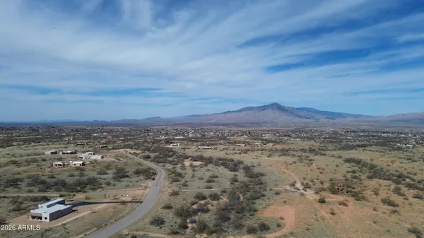 an aerial view of residential house and car parked
