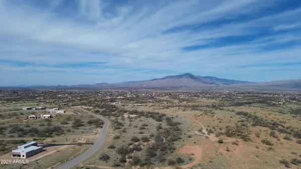 an aerial view of residential house and car parked