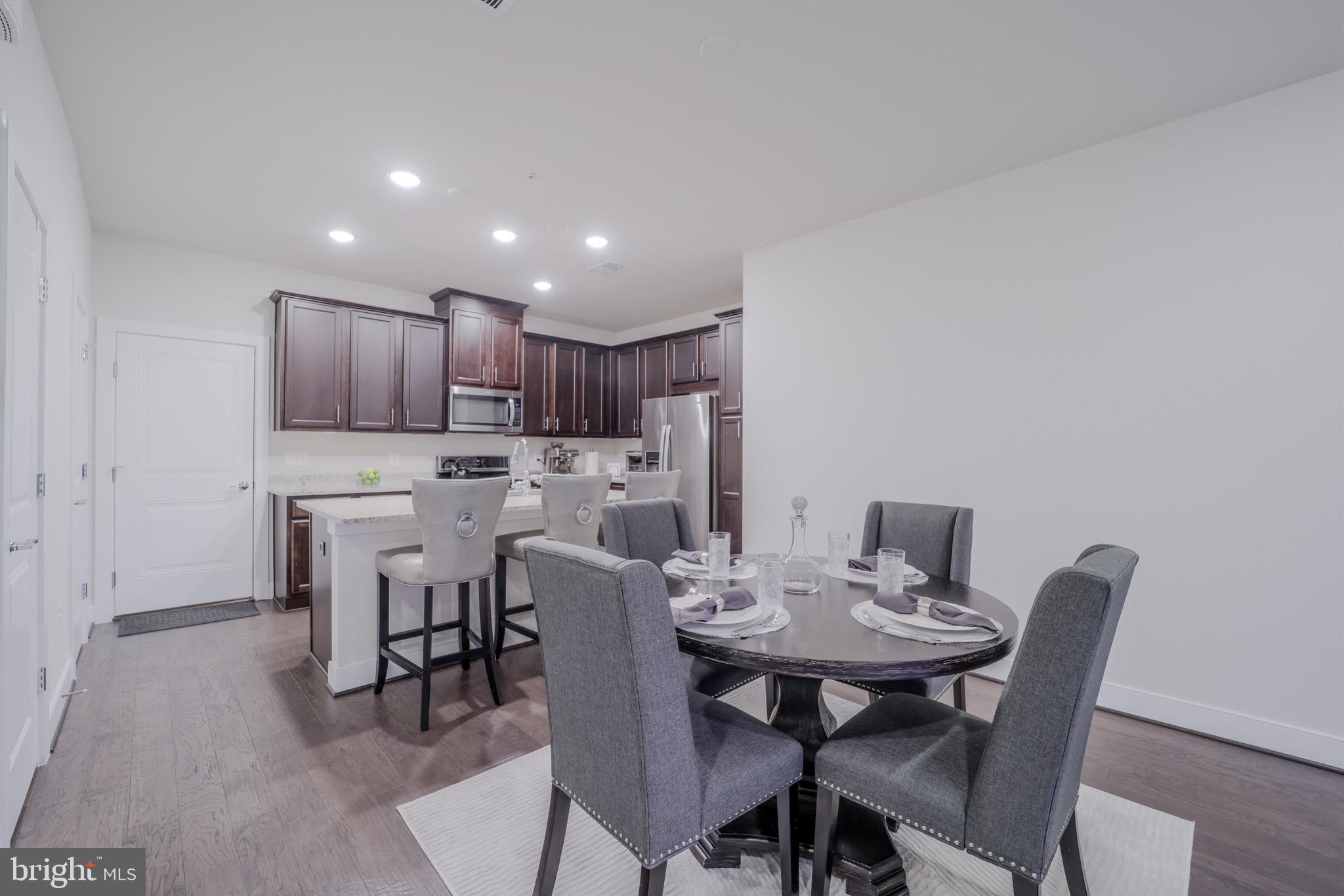 20355 Century Boulevard, Unit 177L Germantown, MD 20874 - Photo 11 of 69 a view of a dining room with furniture