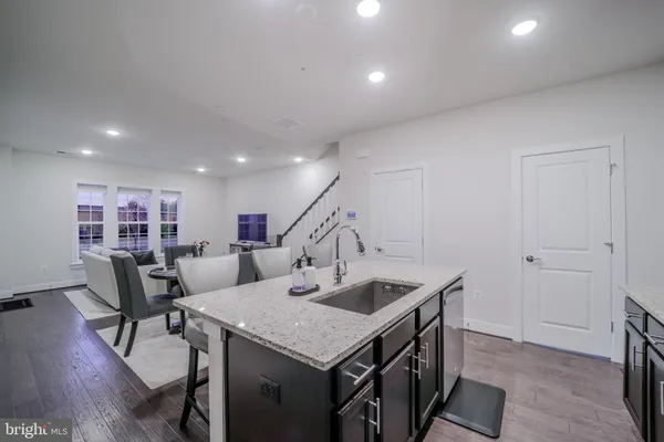 a kitchen that has a table and chairs in it