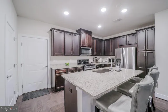 a bedroom with a bed and a desk