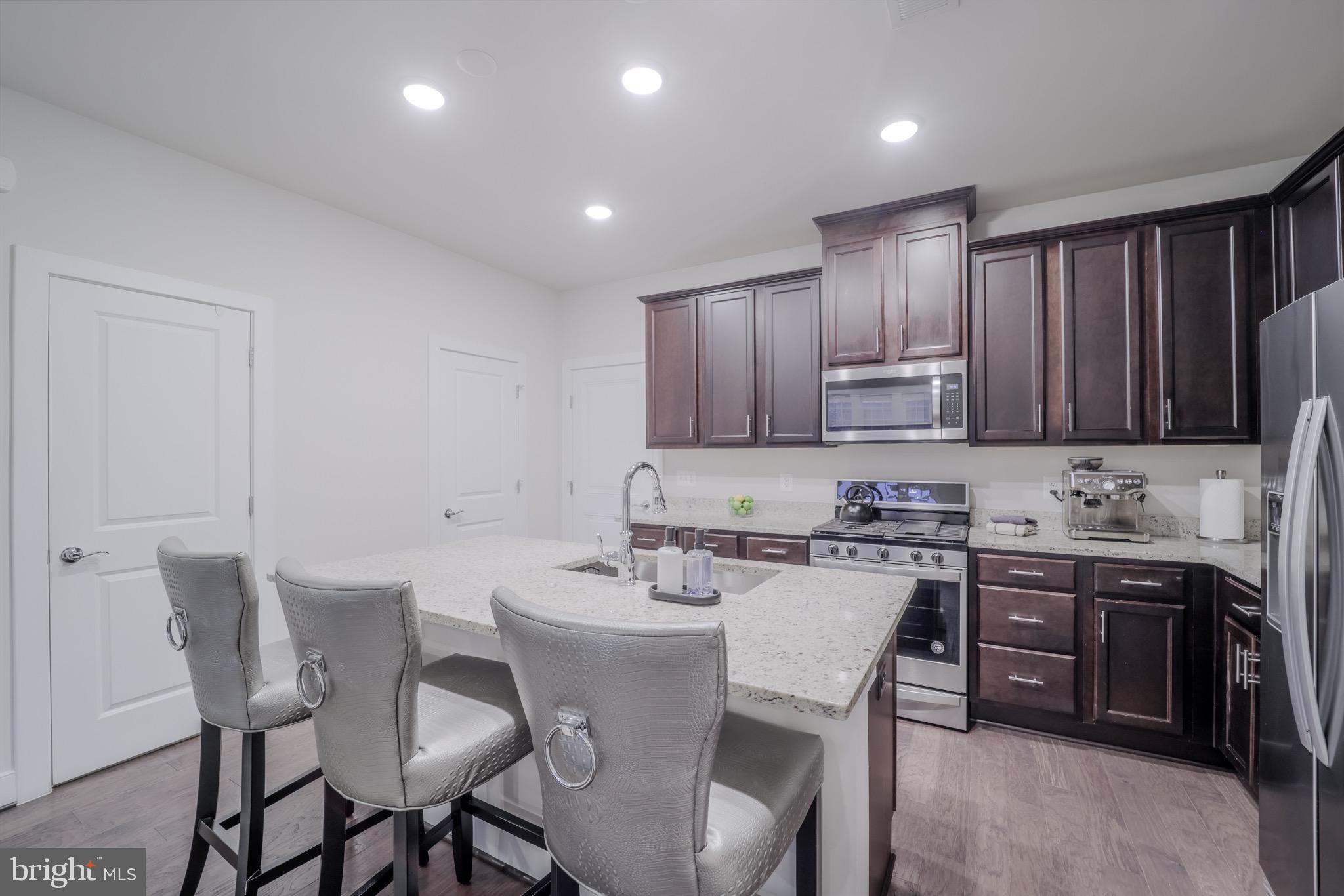 20355 Century Boulevard, Unit 177L Germantown, MD 20874 - Photo 17 of 69 a view of a dining room with furniture