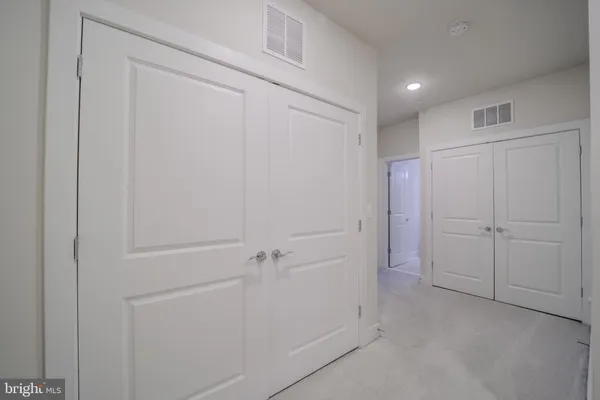 a bedroom with a bed and a desk