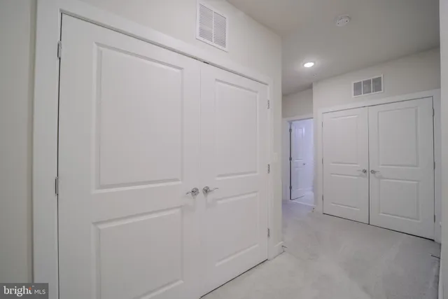 a bathroom with a double vanity sink and mirror