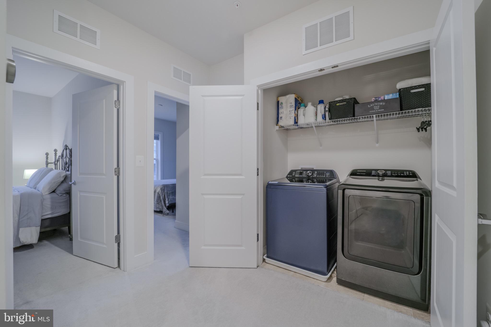 20355 Century Boulevard, Unit 177L Germantown, MD 20874 - Photo 21 of 69 a view of a kitchen with fridge and rack