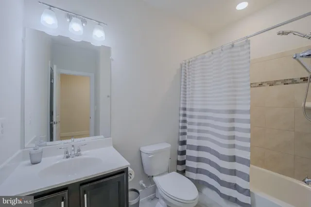 a bedroom with a bed and flat screen tv