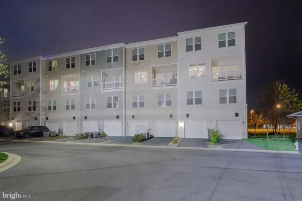 a view of a street with red and white house