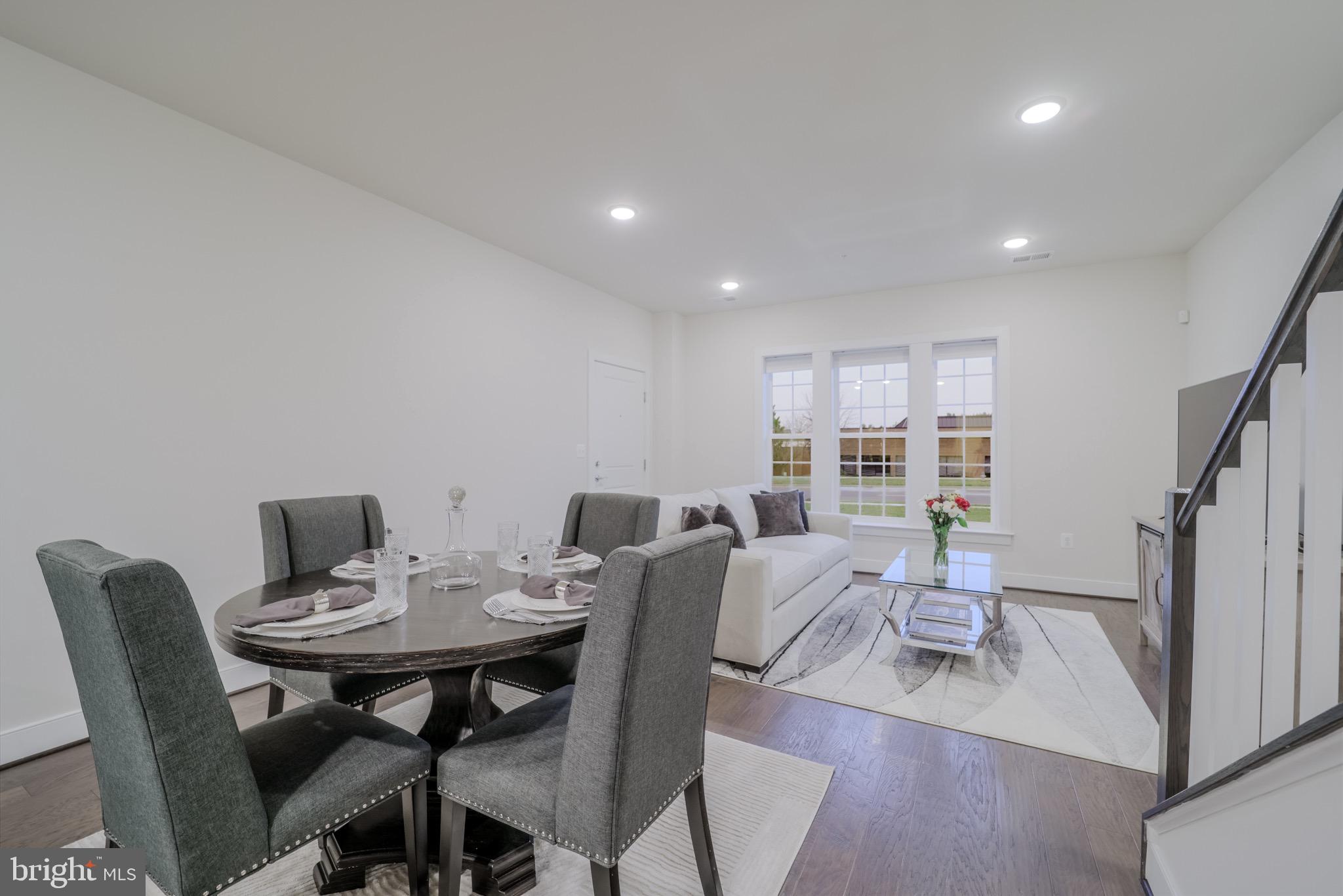 20355 Century Boulevard, Unit 177L Germantown, MD 20874 - Photo 8 of 69 a view of a dining room with furniture window and wooden floor