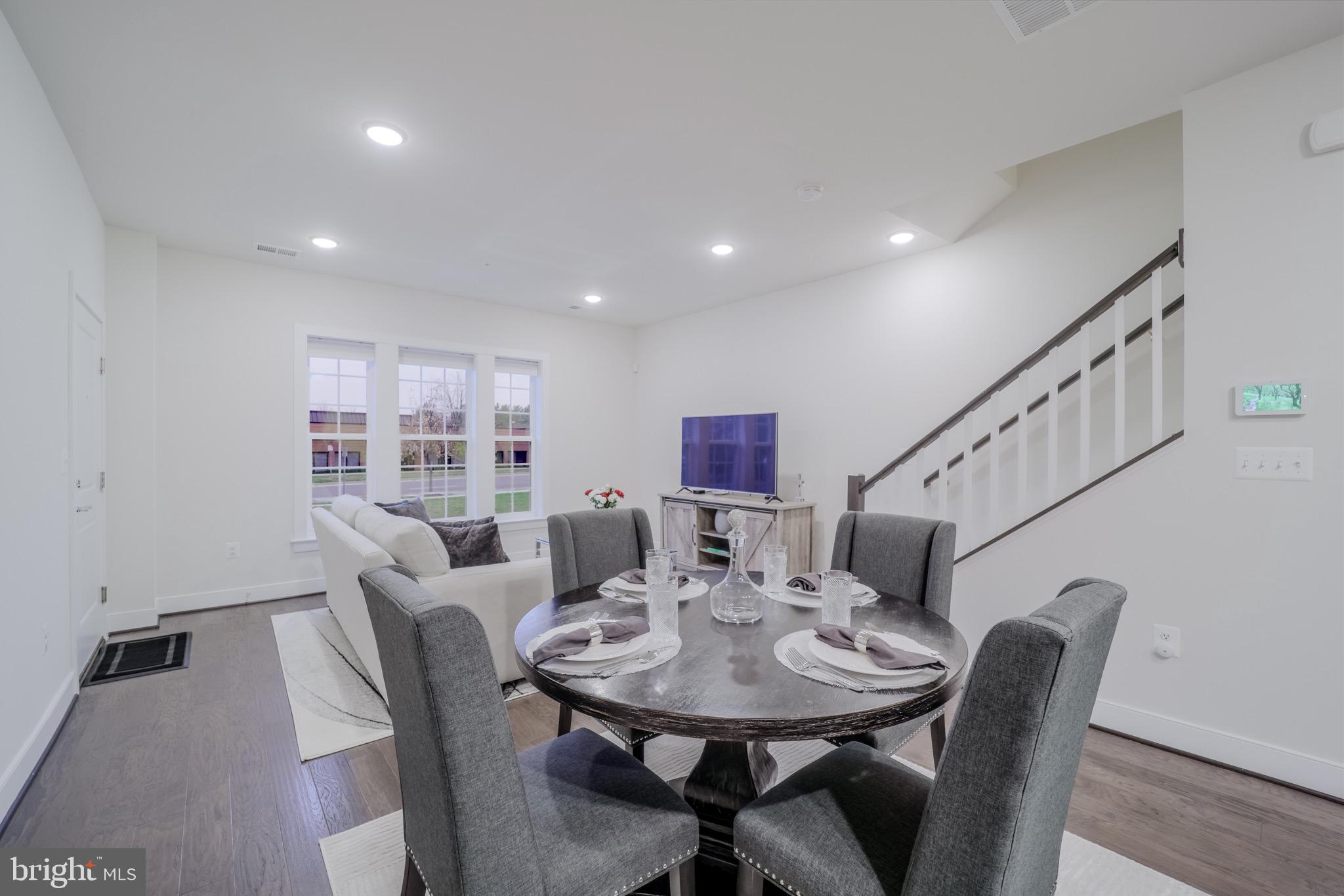 20355 Century Boulevard, Unit 177L Germantown, MD 20874 - Photo 9 of 69 a view of a dining room with furniture