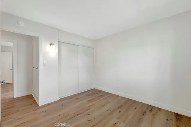 a bathroom with a toilet a sink a vanity and mirror
