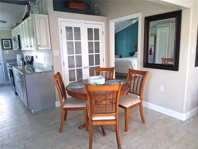 a dining room with furniture and window