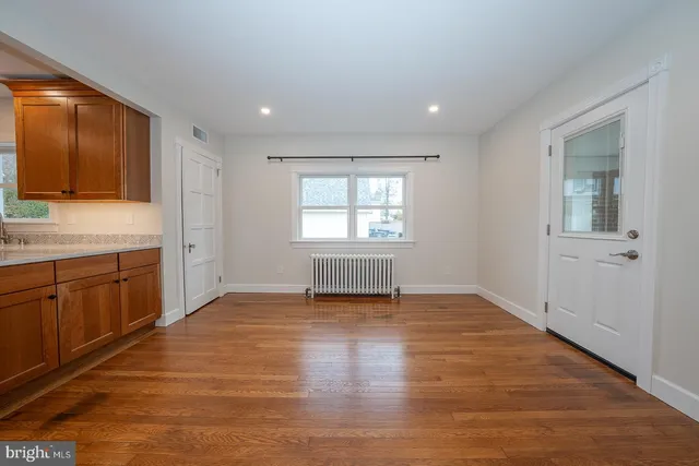 a view of a kitchen with a sink and a window
