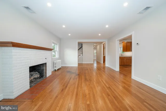 a view of living room with wooden floor