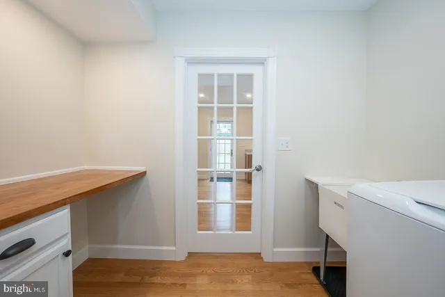 a utility room with sink washer and dryer
