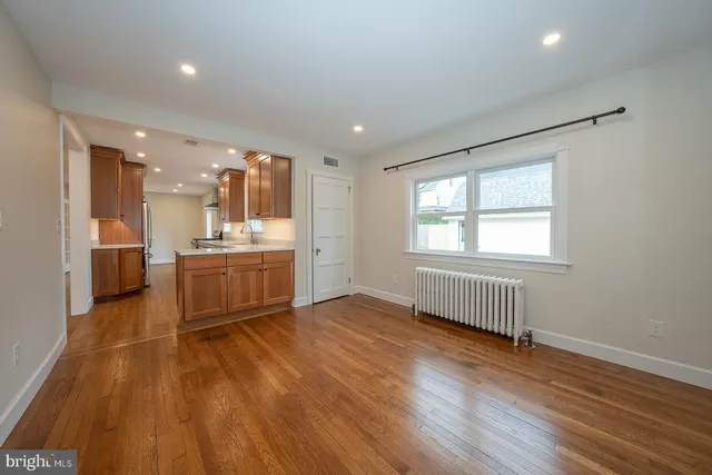 a view of living room with wooden floor