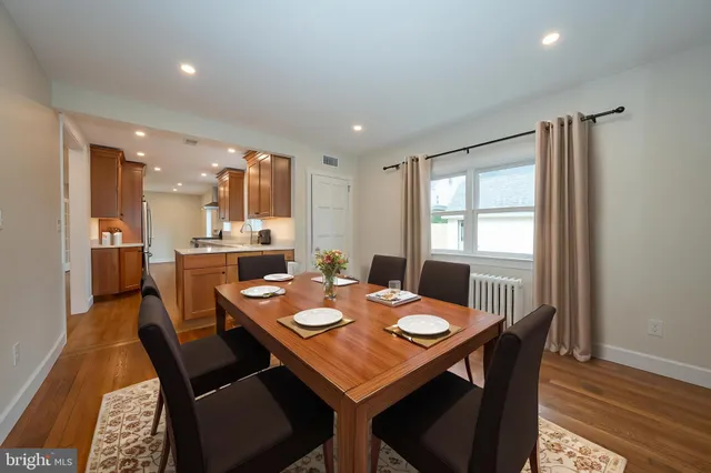 a view of a kitchen with a sink and dishwasher wooden floor