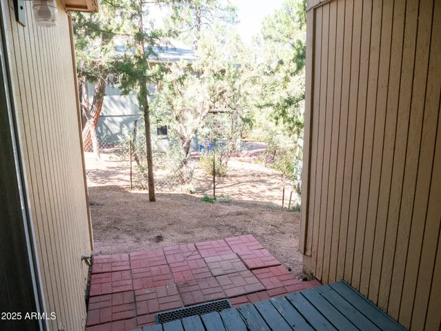 a view of a backyard from a balcony