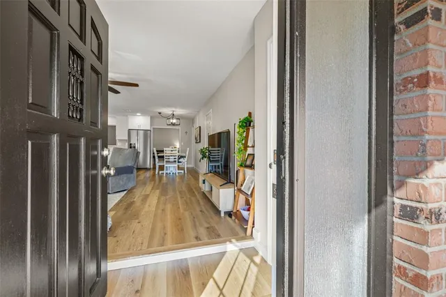 a view of a living room and entry way