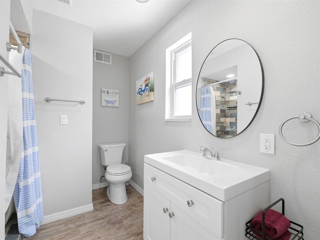 1207 1st Street Indian Rocks Beach, FL 33785 - Photo 20 of 60 a bathroom with a sink and a mirror