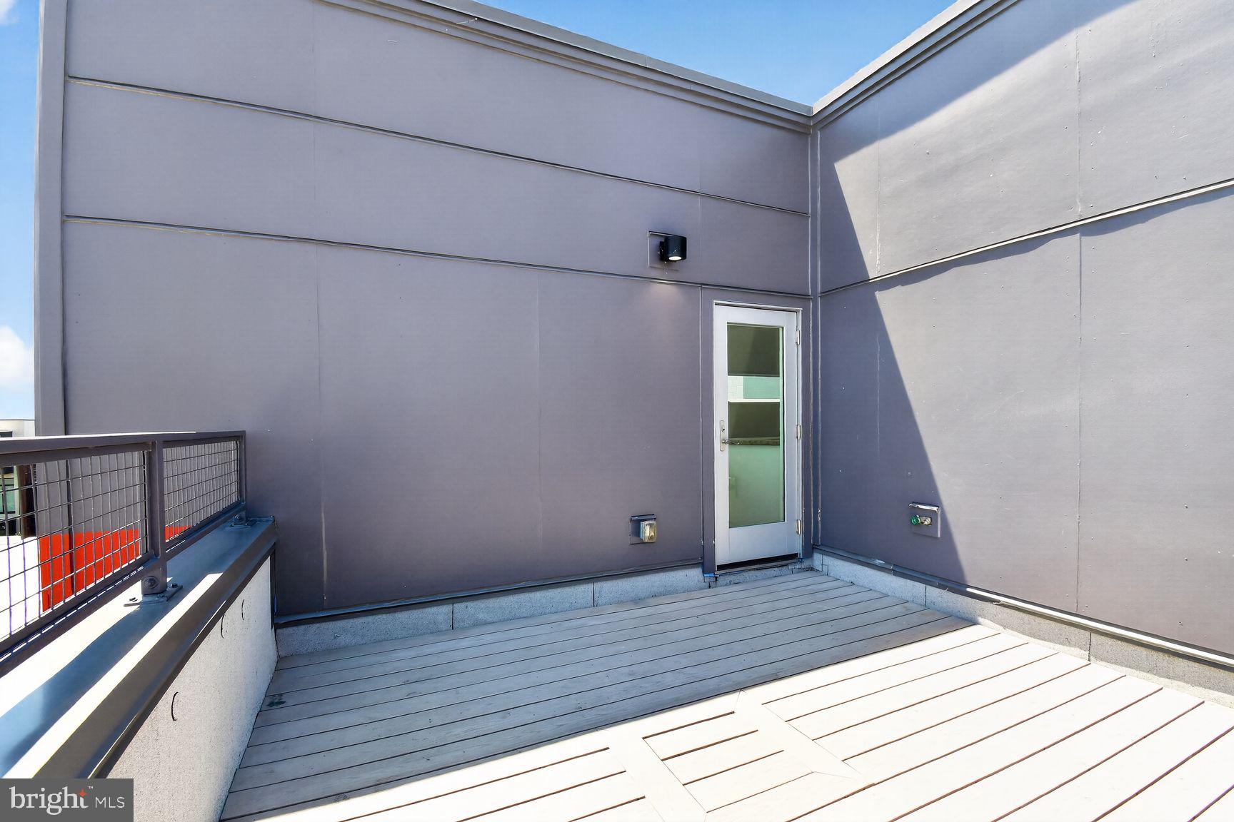 1443 Chapin Street Northwest, Unit 403 Washington, DC 20009 - Photo 21 of 24 a view of outdoor space with wooden floor and staircase