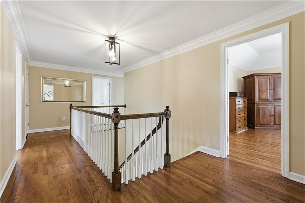 900 Settlers Ridge Road Pittsburgh, PA 15238 - Photo 23 of 50 The spacious upper-level landing serves as a central hub connecting the owner's suite and three additional bedrooms.