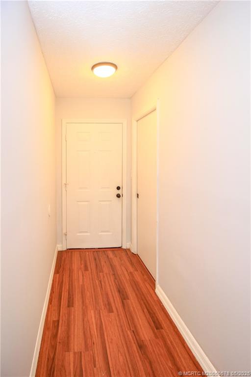 801 Southeast Central Parkway, Unit 8019 Stuart, FL 34994 - Photo 11 of 41 a view of a room with wooden floor