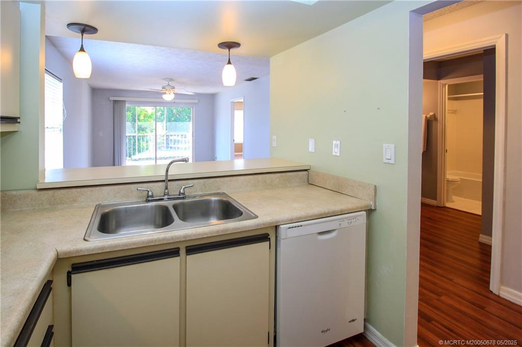 801 Southeast Central Parkway, Unit 8019 Stuart, FL 34994 - Photo 21 of 41 a utility room with a sink and a window