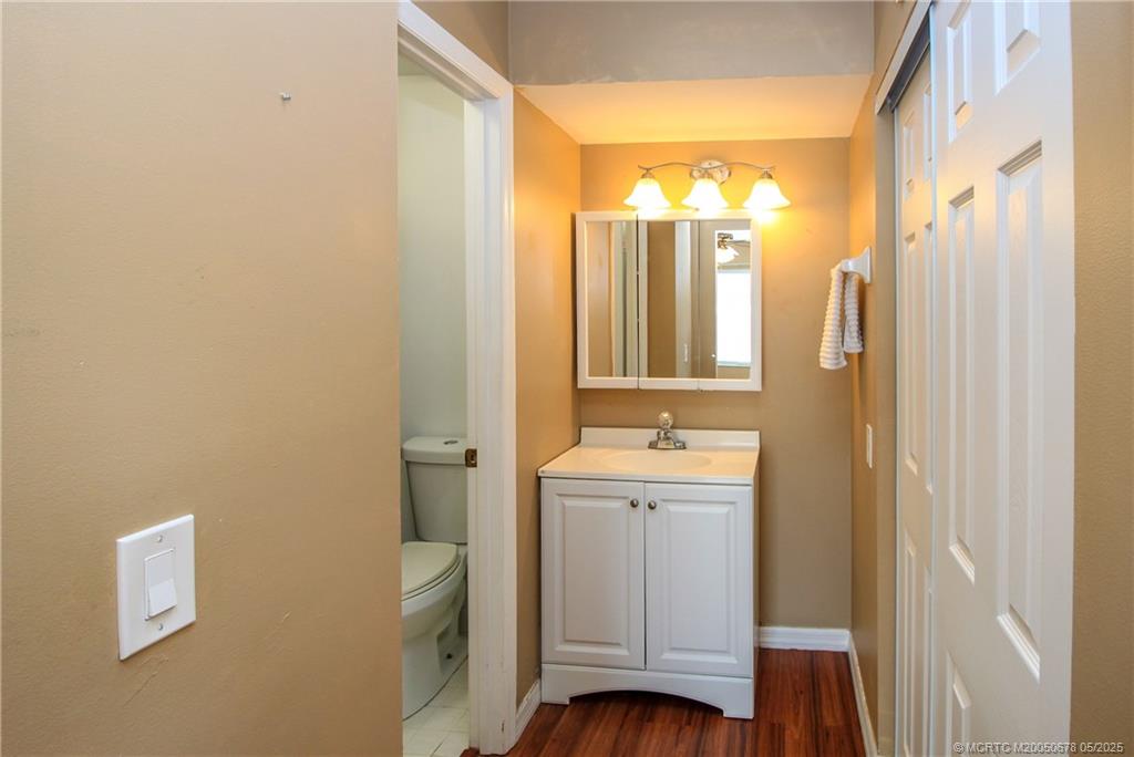 801 Southeast Central Parkway, Unit 8019 Stuart, FL 34994 - Photo 25 of 41 a bathroom with a double vanity sink toilet and shower