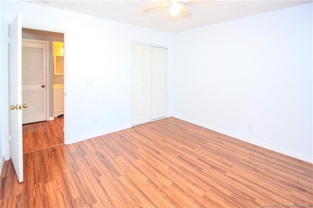 801 Southeast Central Parkway, Unit 8019 Stuart, FL 34994 - Photo 28 of 41 a view of empty room with wooden floor