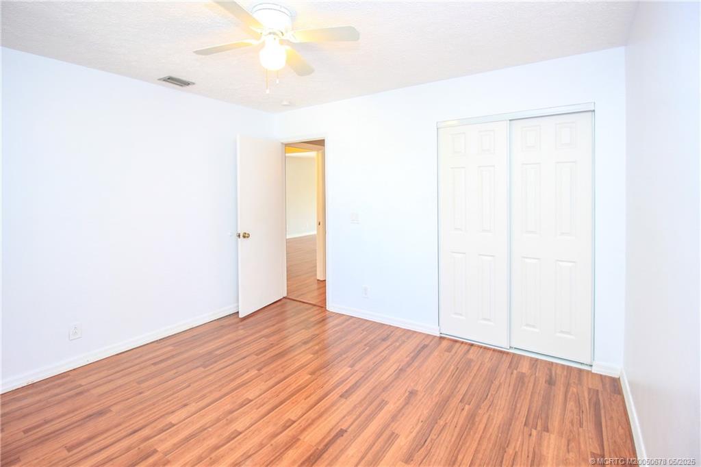 801 Southeast Central Parkway, Unit 8019 Stuart, FL 34994 - Photo 29 of 41 a view of an empty room with wooden floor