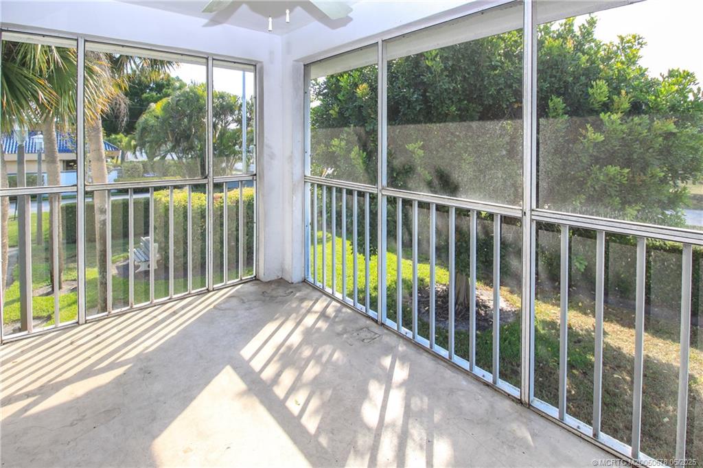 801 Southeast Central Parkway, Unit 8019 Stuart, FL 34994 - Photo 32 of 41 a view of a balcony with a floor to ceiling window