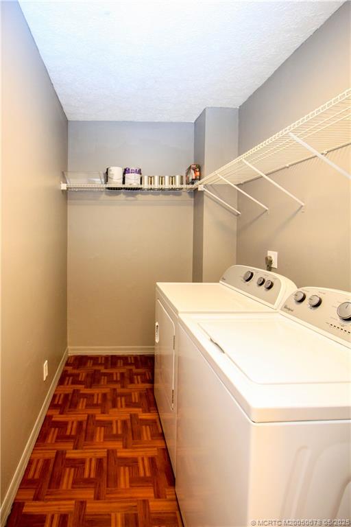 801 Southeast Central Parkway, Unit 8019 Stuart, FL 34994 - Photo 36 of 41 a utility room with dryer and washer