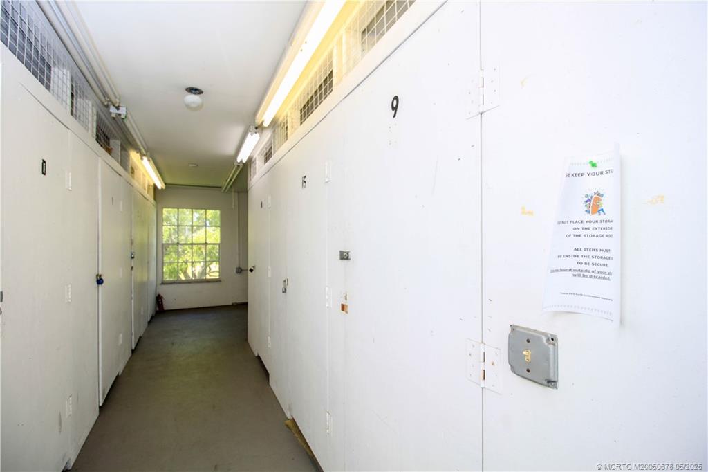 801 Southeast Central Parkway, Unit 8019 Stuart, FL 34994 - Photo 37 of 41 a view of a hallway with windows