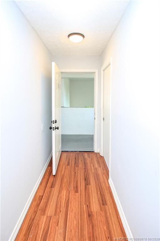 801 Southeast Central Parkway, Unit 8019 Stuart, FL 34994 - Photo 10 of 41 a view of a room with wooden floor