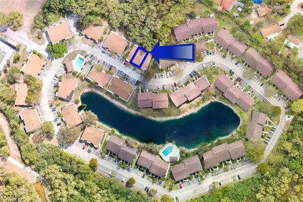 a view of a swimming pool with a yard